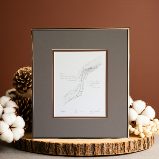 Framed artwork on a wooden stand with decorative elements on a brown background