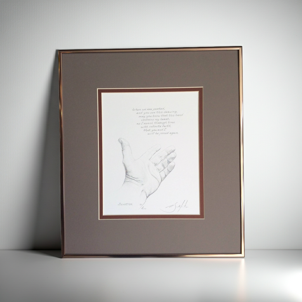 Framed artwork of a handprint on a white background