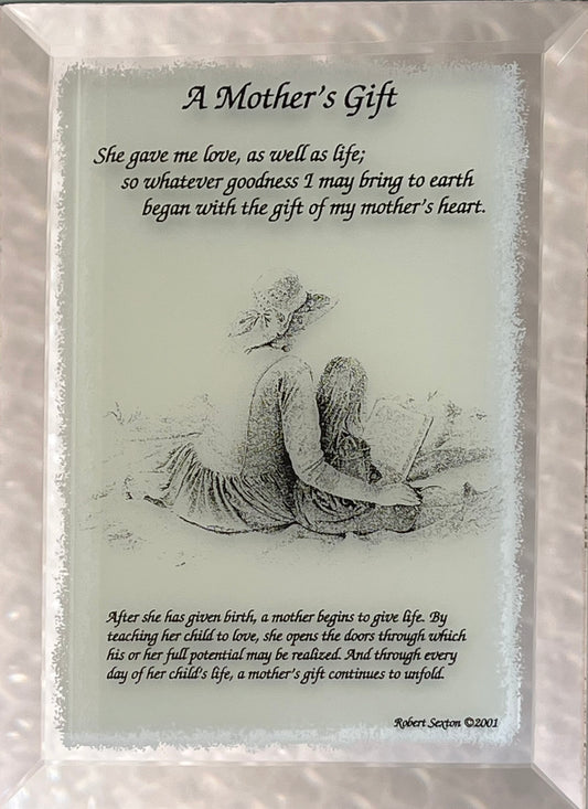 Framed print with a mother and child illustration and poem on a reflective surface