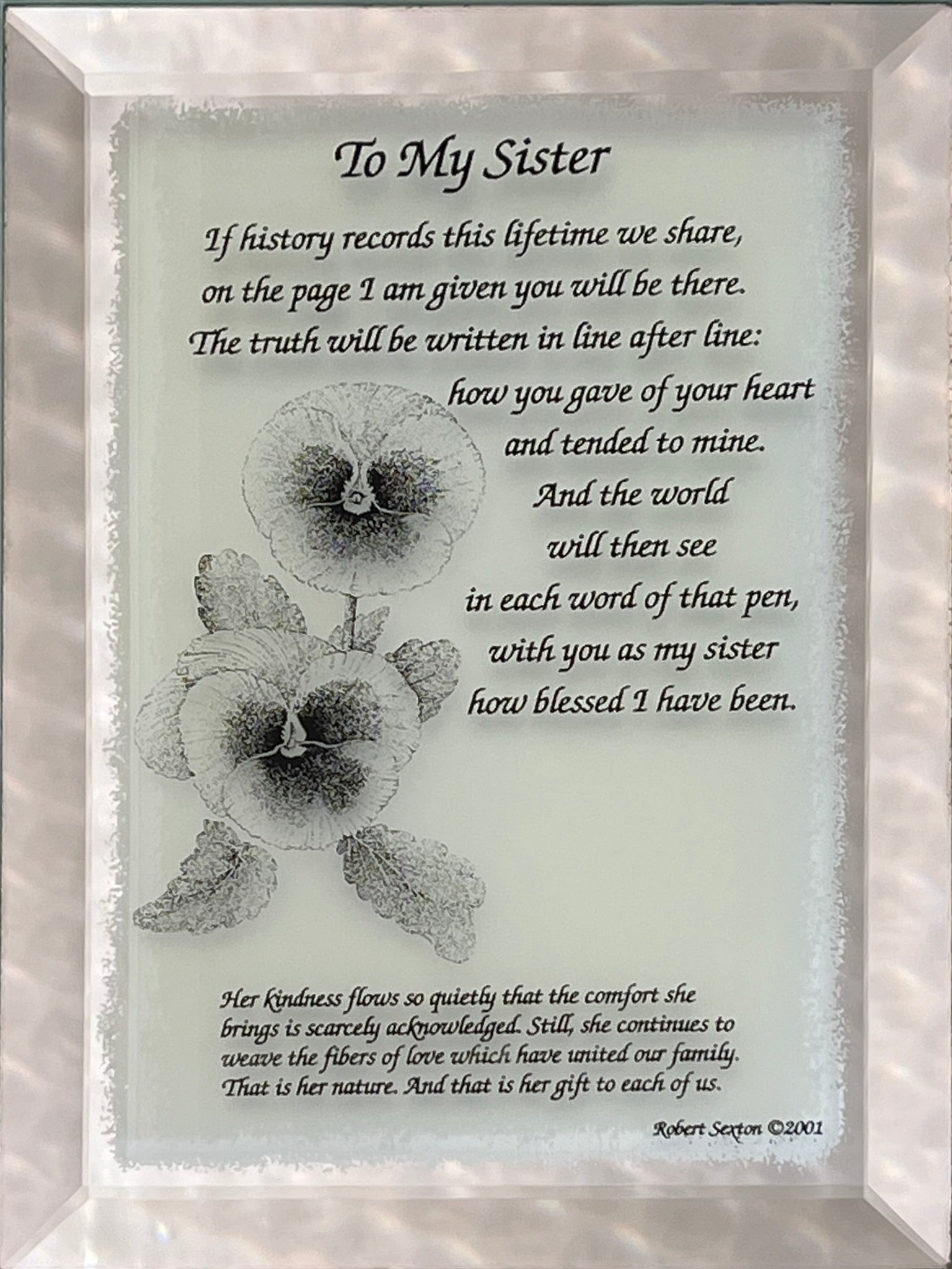 Framed poem titled 'To My Sister' with a floral design on a light background.