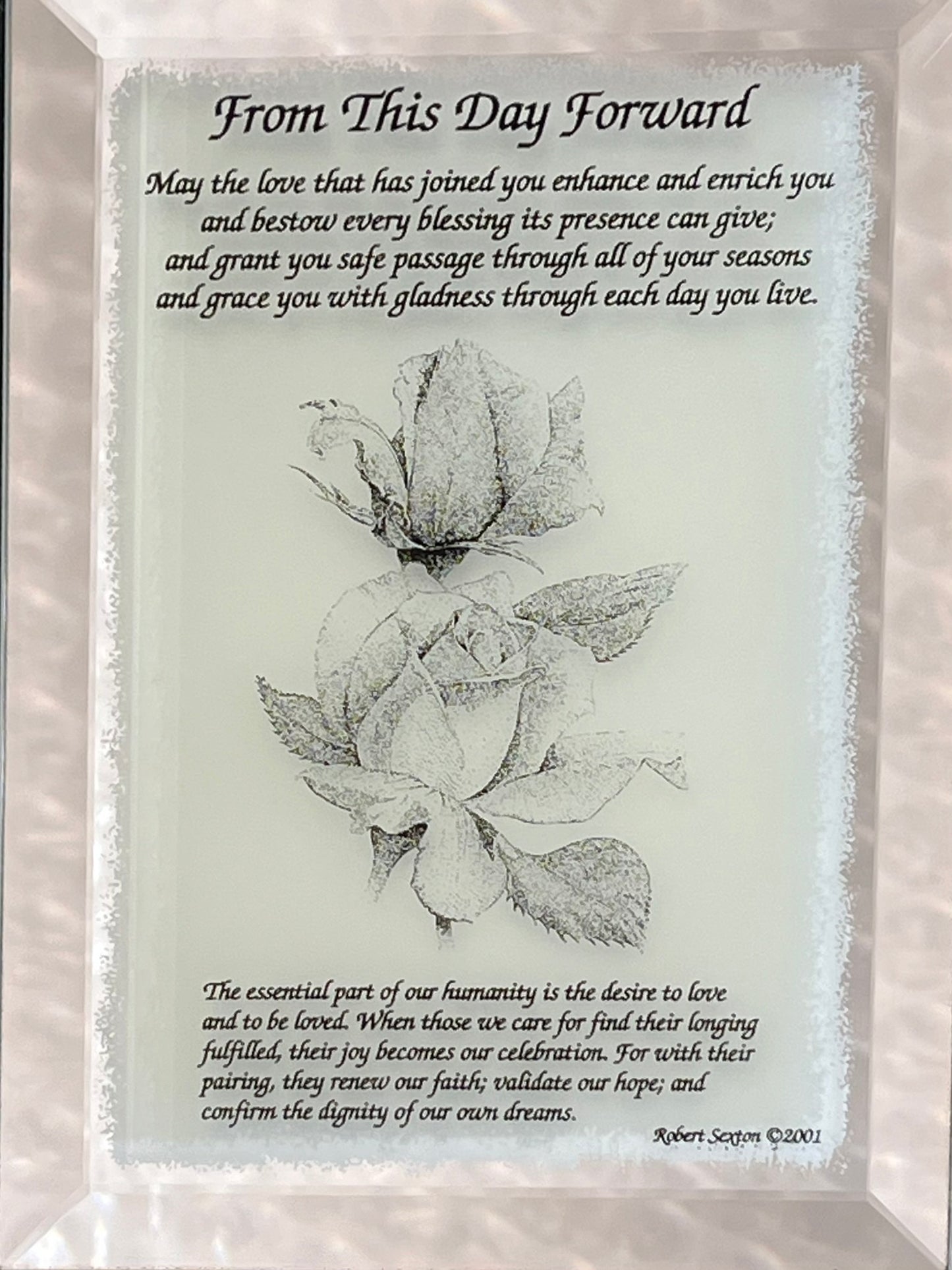 Decorative plaque with floral design and inspirational text 