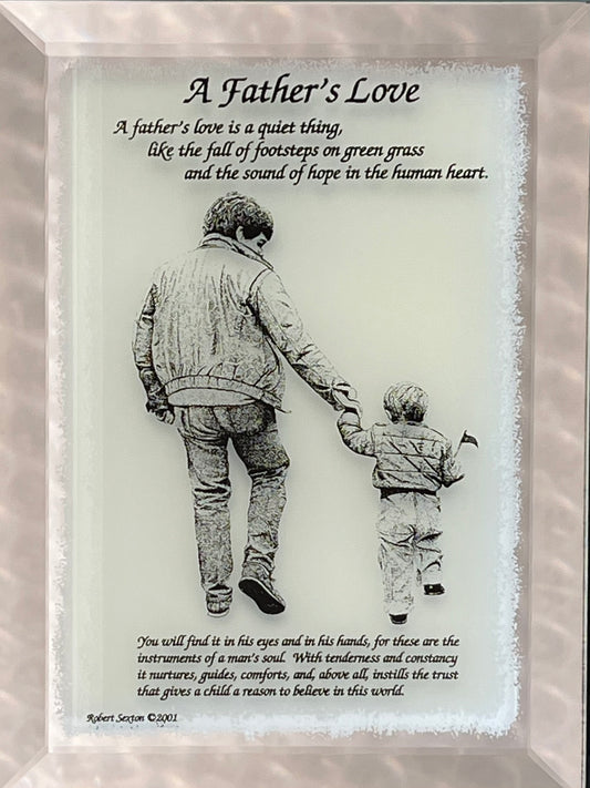 Framed artwork of a father and son holding hands with a quote about father's love.