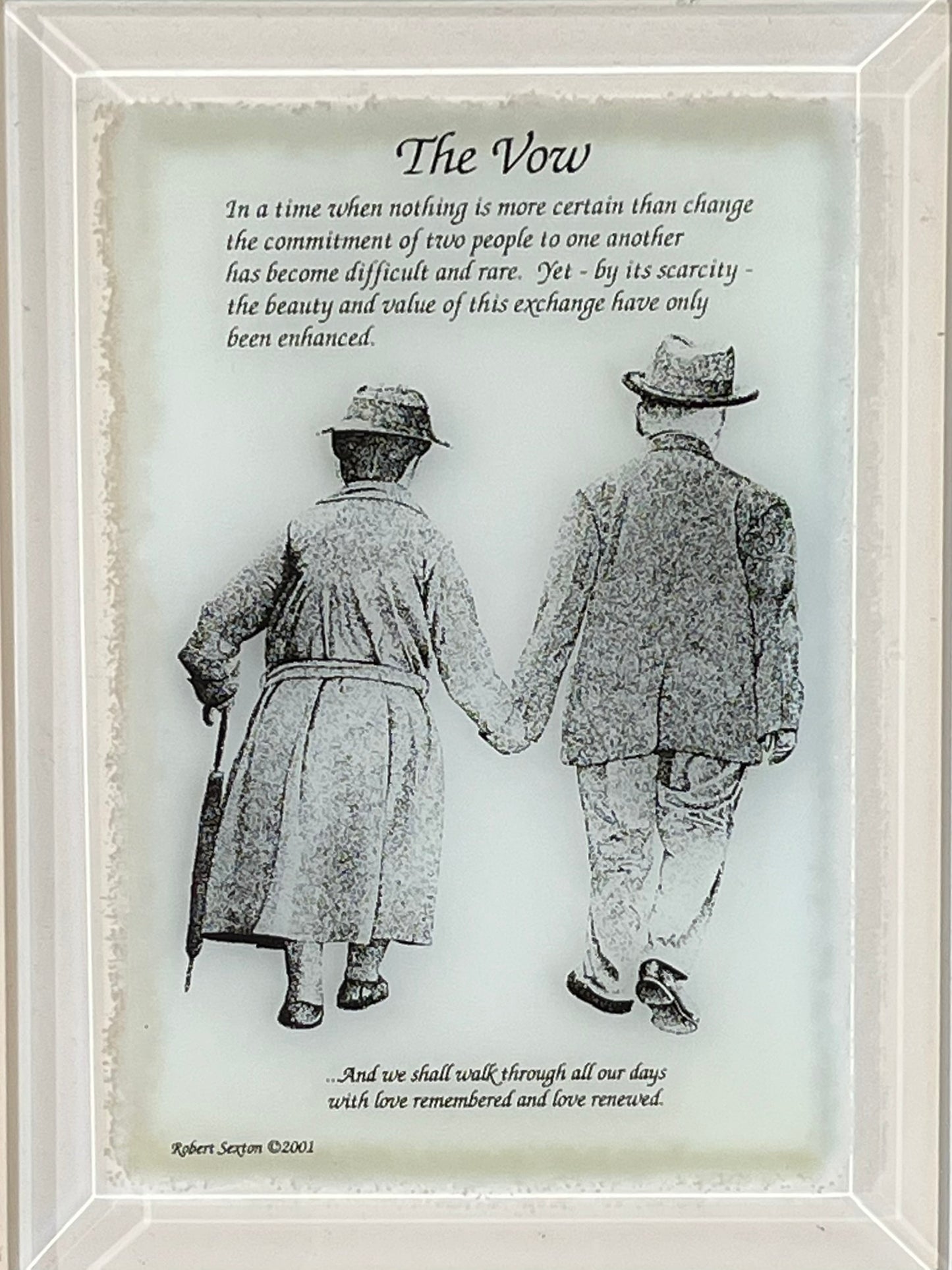 Framed artwork of two people holding hands with a poem titled 'The Vow' 