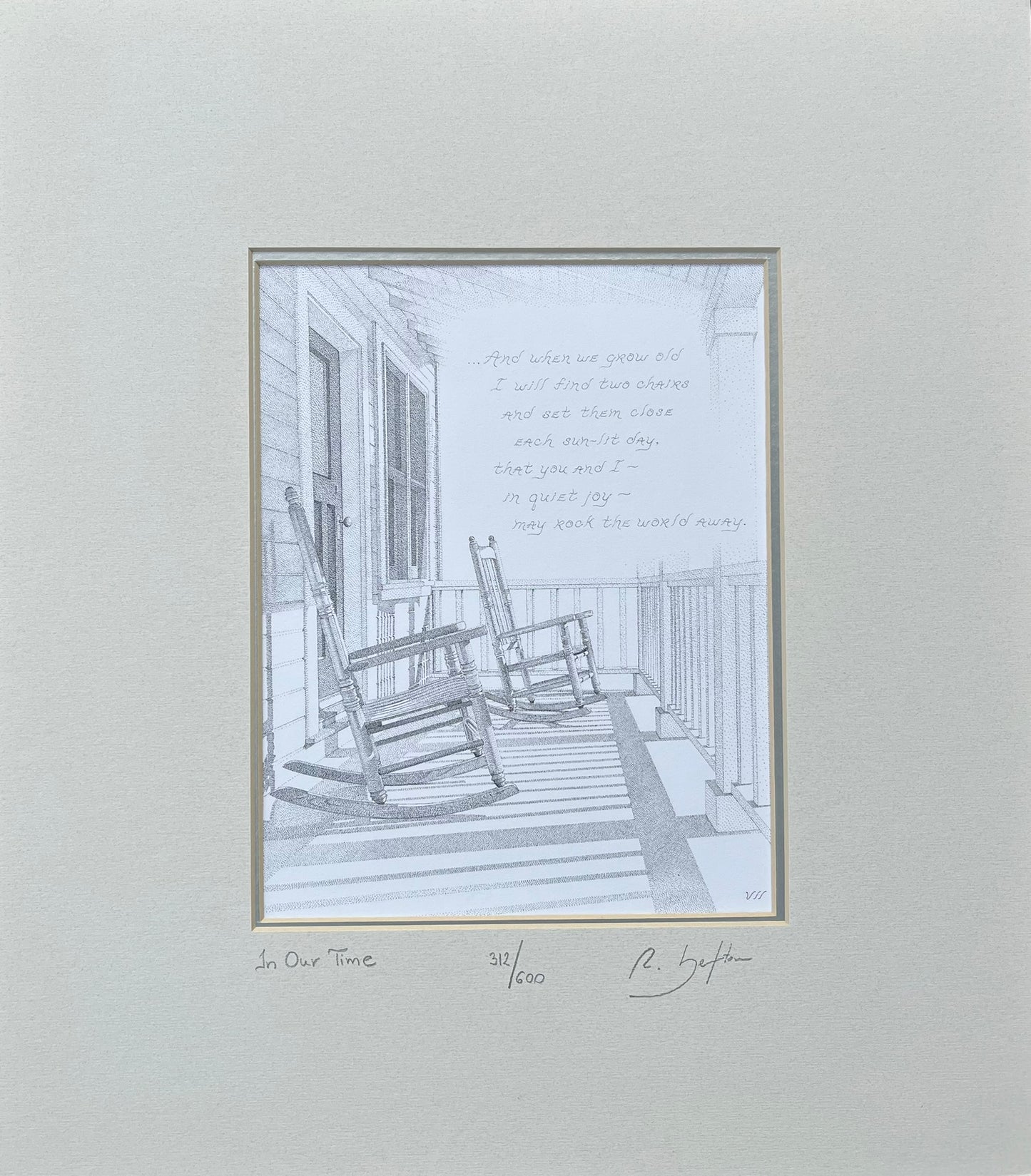 Framed black and white print of a porch scene with rocking chairs on a light gray background