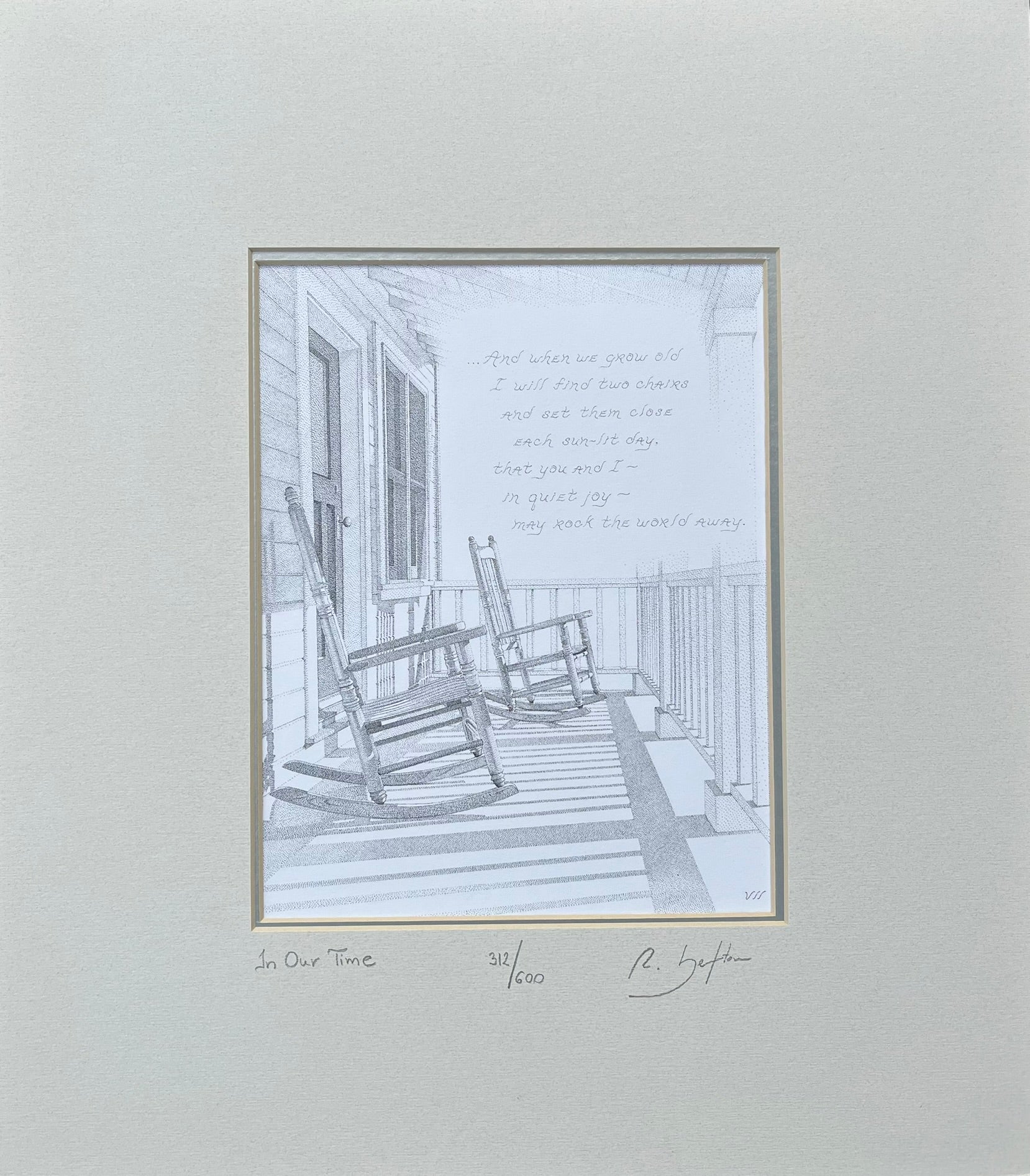 Framed black and white print of a porch scene with rocking chairs on a light gray background