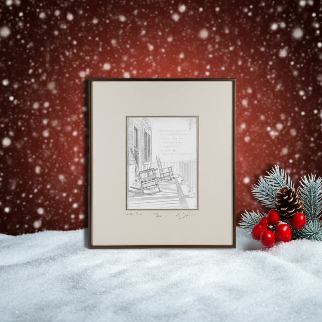 Framed black and white print of a porch scene with rocking chairs  on a snowy surface with a red background and decorative elements.