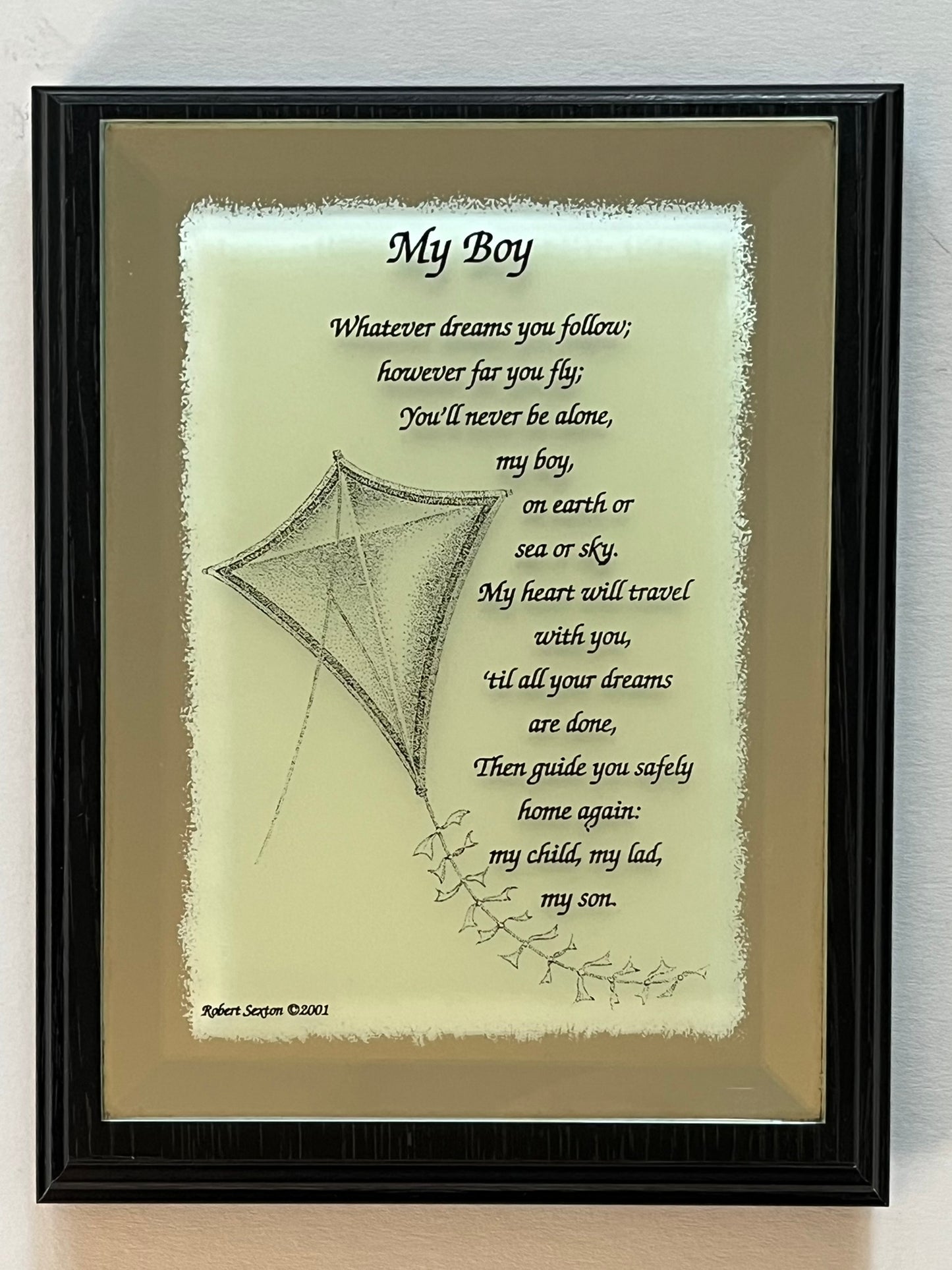 Framed artwork with a kite illustration and quote on a light background