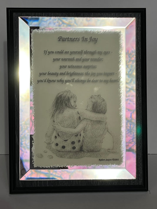 Framed artwork with a couple hugging and a romantic poem titled 'Partners In Joy'.