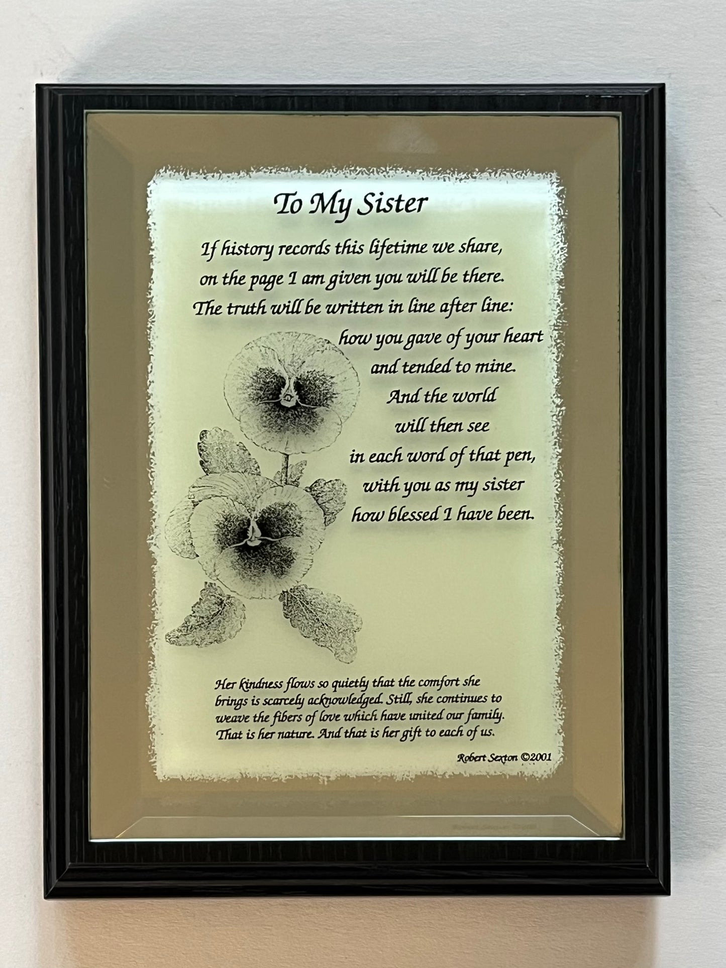 Framed poem titled 'To My Sister' with a floral design on a light background.