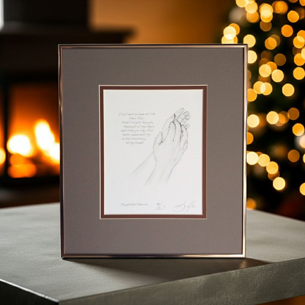 Framed artwork of holding hands with a warm background