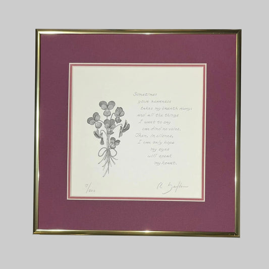 Framed artwork with a floral illustration and love quote on a white background